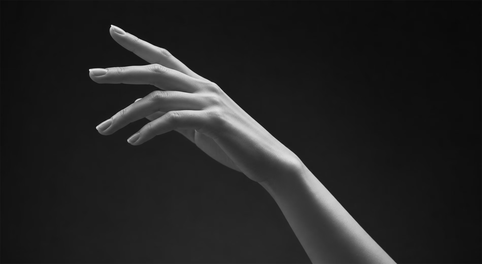 Artistic black and white image of an outstretched hand